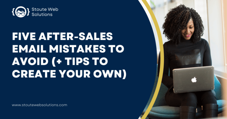 A black, curly woman sitting on a couch is looking happily at the screen of her laptop.