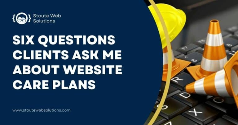 Miniature traffic safety cones and a yellow helmet placed on top of a black keyboard.