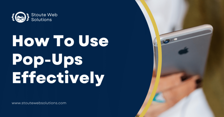 A close-up of the back of a gray phone held in a lady's hand.