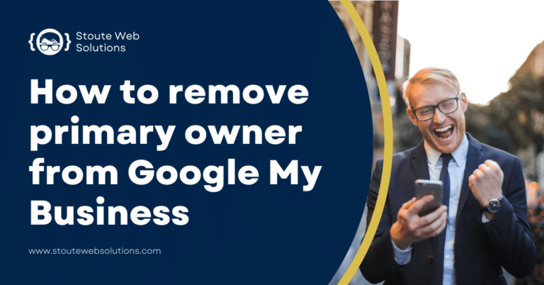 A man in a business suit is feeling great as he looks onto his phone.