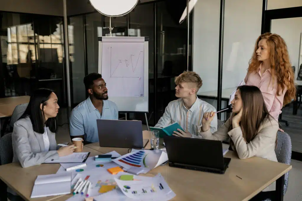A group of people having a meeting in the office